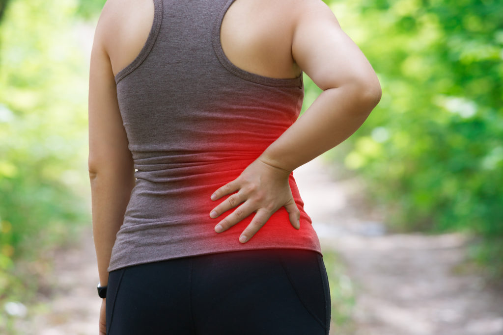 woman having a sciatica pain after jogging