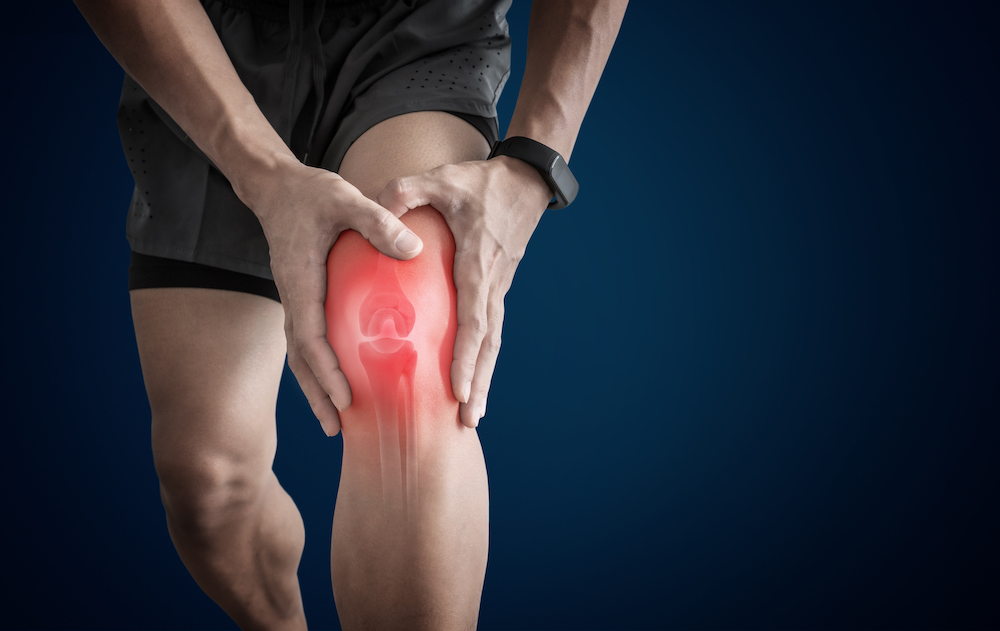man having knee pain from overuse