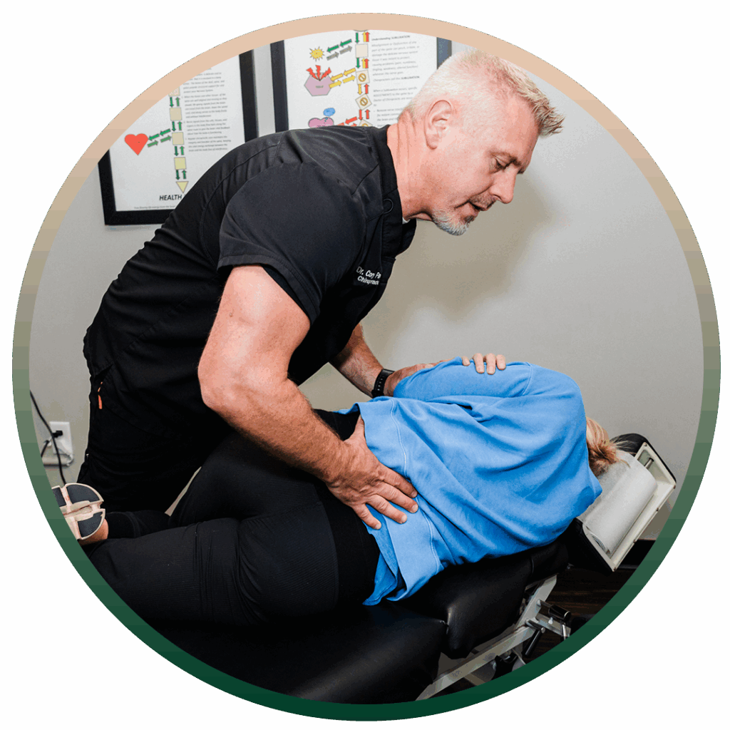 Dr. Cory Powers giving patient hip pain treatment
