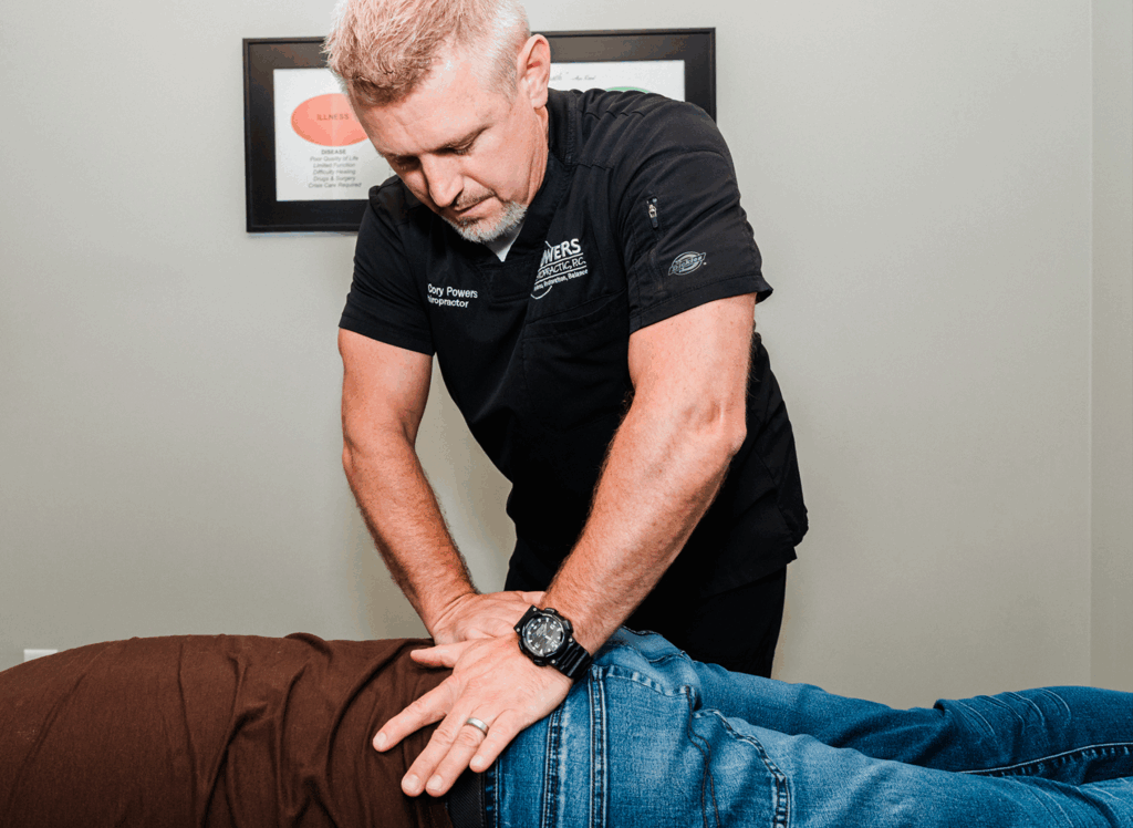 Dr Cory Powers giving his patient a hip pain massage